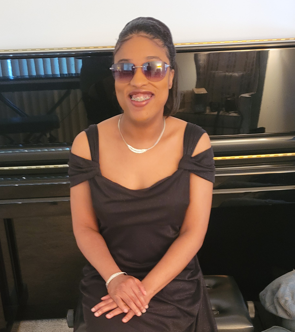 Genene Blackwell at home with the piano